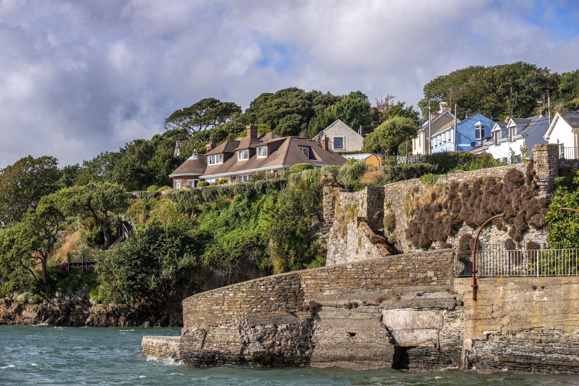Houses and the small jetty on the coast of Kinsale, County Cork