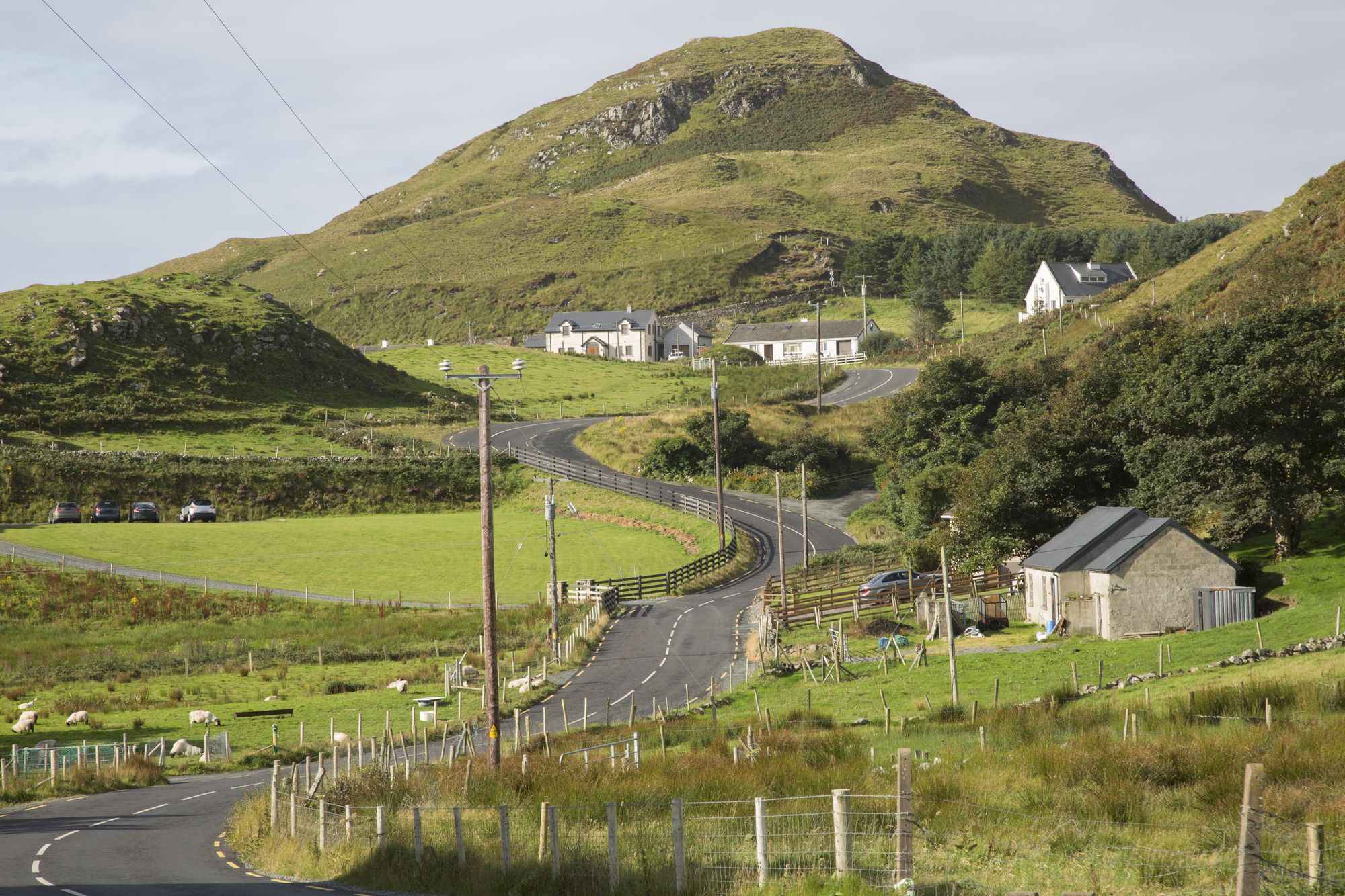 Teelin village under its wooded hills, County Donegal